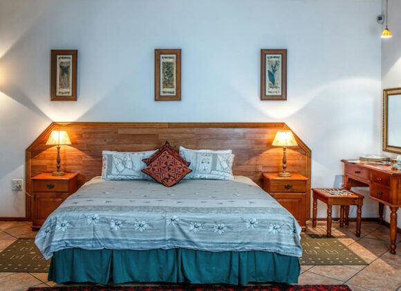 Stylish bedroom featuring wooden furniture and soft lighting for a warm ambiance.